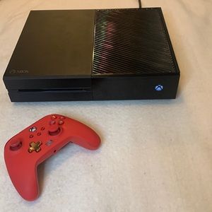 Black Xbox one with red controller